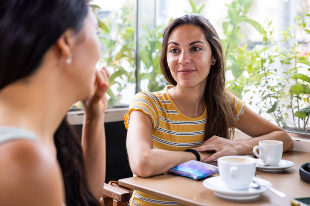 istock Two women best friends enjoying a coffee break 2169865174