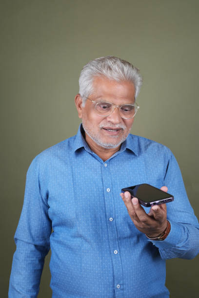 istock Confident Mature Man Smiling Against Off-White Background - Portrait 2169865760