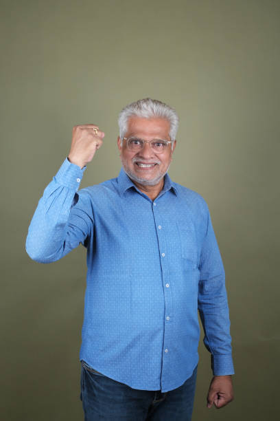 istock Confident Mature Man Smiling Against Off-White Background - Portrait 2169865852