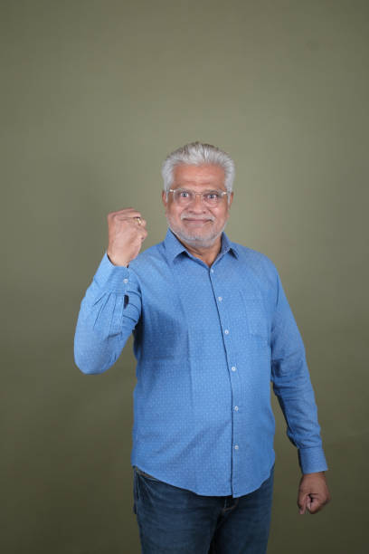 istock Confident Mature Man Smiling Against Off-White Background - Portrait 2169865853