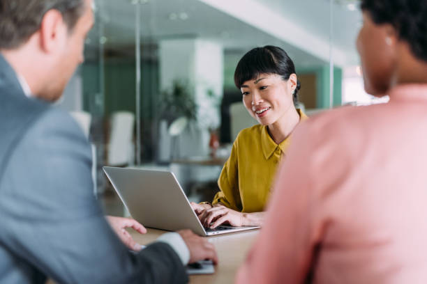 istock Group of business persons talking in the office. 2169865945