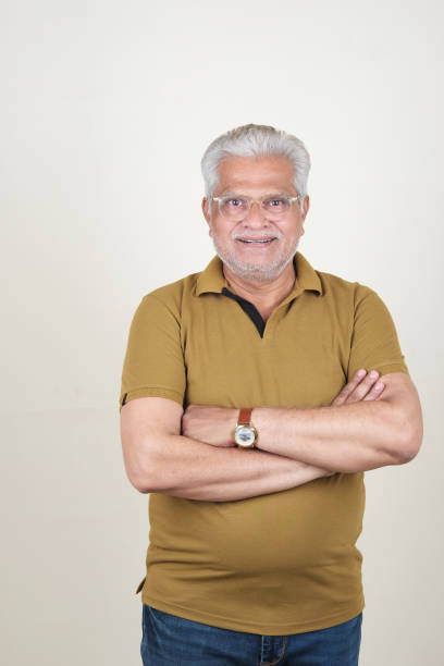 istock Confident Mature Man Smiling Against Off-White Background - Portrait 2169866654