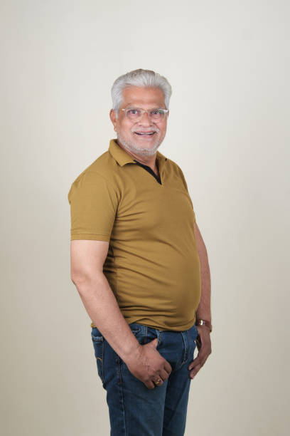 istock Confident Mature Man Smiling Against Off-White Background - Portrait 2169866745