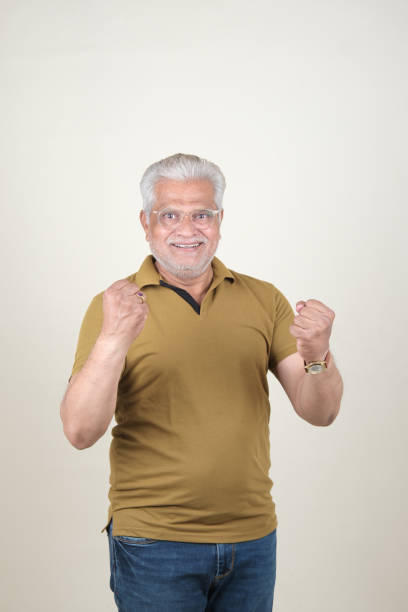 istock Confident Mature Man Smiling Against Off-White Background - Portrait 2169866797