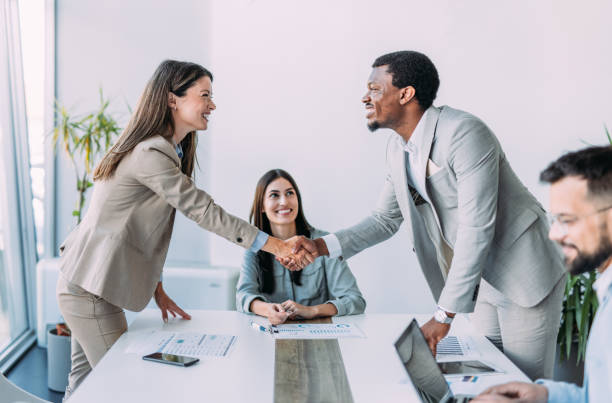 istock Businesspeople shaking hands across the table. 2169867092