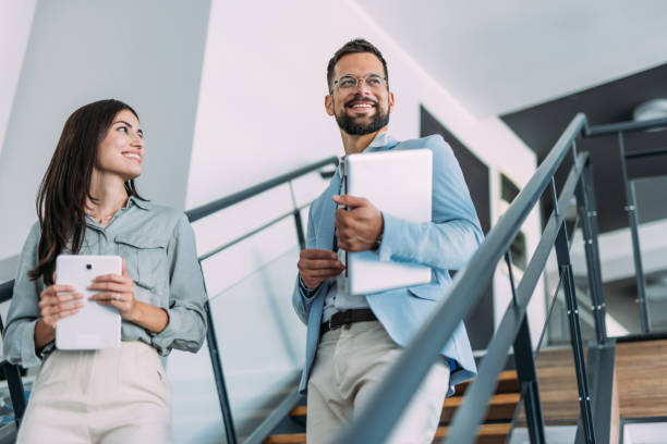 istock Business colleagues talking on stairs in the office. 2169867193