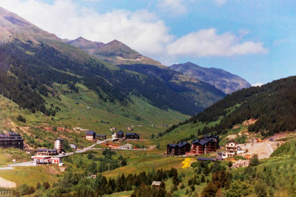 Picturesque mountains, meadow, bright sunrise and walking path. Summer Andorra. Wide photo.
