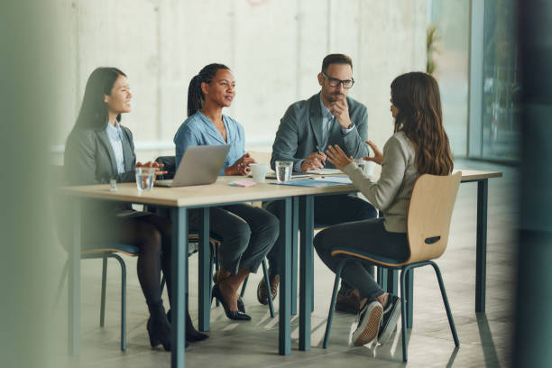 istock Mixed race human resource team talking to a candidate on a job interview. 2169869363