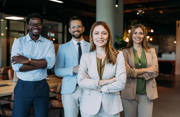 istock Confident businesswoman and her team. 2169869982