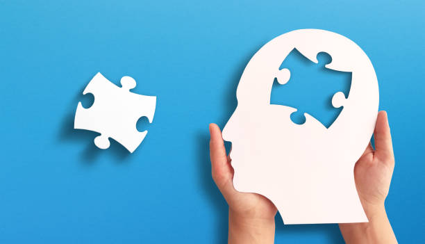 istock Head and brain diseases concept. A missing piece of the brain puzzle on blue background. 2169870040