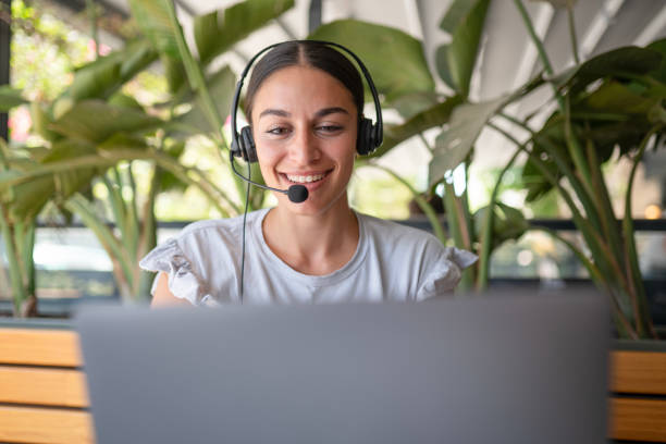 istock Call Center Employee Providing Customer Service in a Cafe 2169872669