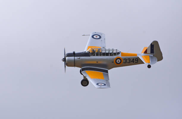 Little Gransden, Cambridgeshire, England -  August 25, 2024: Vintage  North American NA-64 Yale Second World War training plane in flight