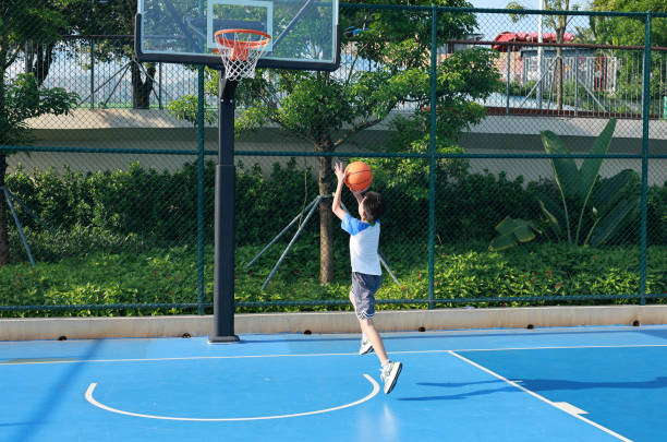 istock Cute Asian boy playing basketball 2169883693
