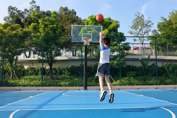 istock Cute Asian boy playing basketball 2169883728