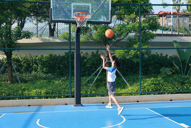 istock Cute Asian boy playing basketball 2169883731