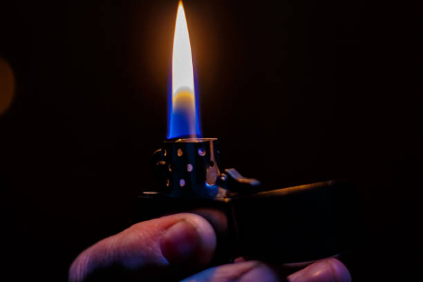 istock Classic petrol lighter. Burning petrol lighter 2169883974