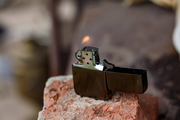 istock Classic petrol lighter. Burning petrol lighter 2169883992