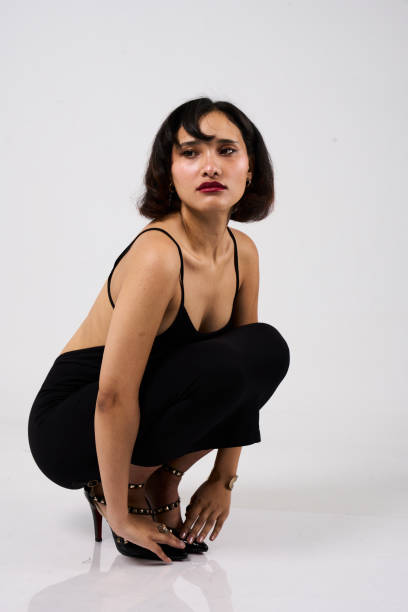 istock Elegant Young Woman In Studio 2169884230