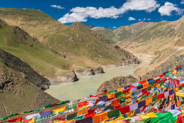 istock Buddhist prayer flags hanging from an unidentified peak over Smira La pass 2169885171