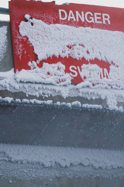 istock Red Danger sign covered with thick snow 2169889399
