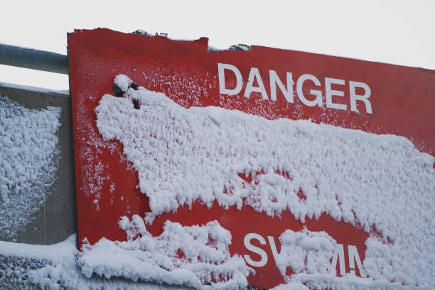 istock Red Danger sign covered with thick snow 2169889534