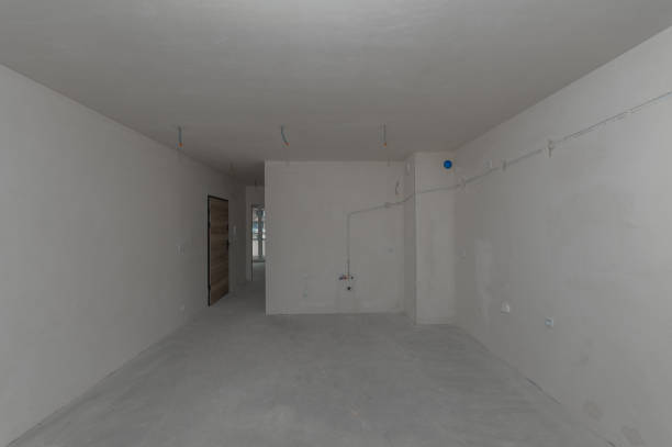 Interior of a residential apartment in a developer's condition, empty walls, unfinished