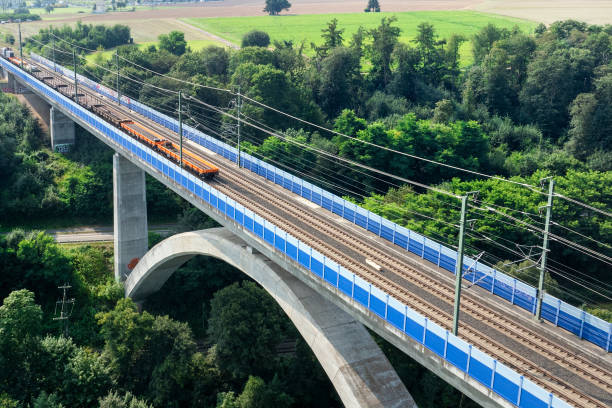 istock Railway bridge over river - aerial view 2169897939