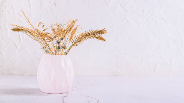 istock Figured vase with dried flowers on a white background copy space 2169899943