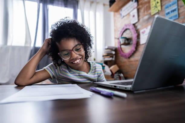 istock Child girl studying at home 2169900748