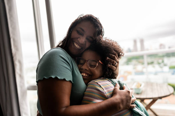 istock Mother and daughter embraced at home 2169900886