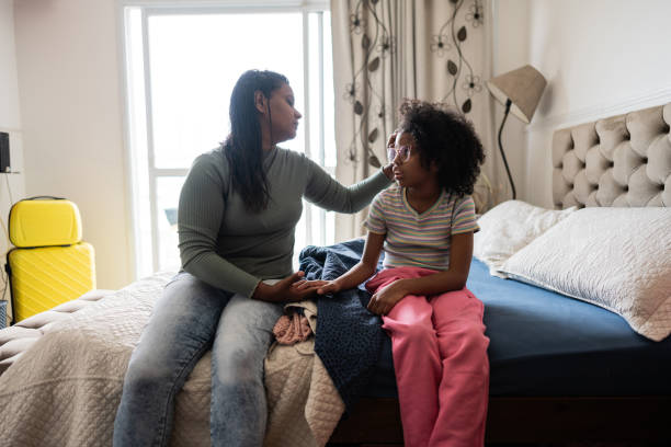 istock Mother talking to sad daughter at home 2169900966