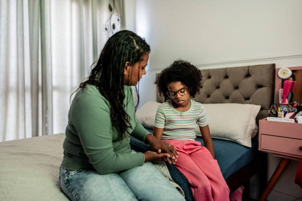 istock Mother talking to sad daughter at home 2169901013