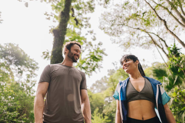 istock Friends talking while walking at the park 2169902061