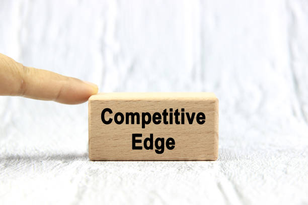 istock Competitive edge wording or text on wood block with hand on white background.Copy space and business concept. 2169903248