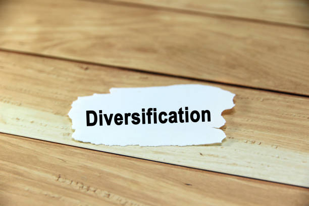 istock Diversification wording or text on white paper with brown background.Copy space and business concept. 2169903272