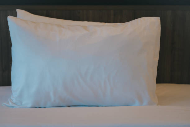 istock White pillow on bed in hotel 2169903929