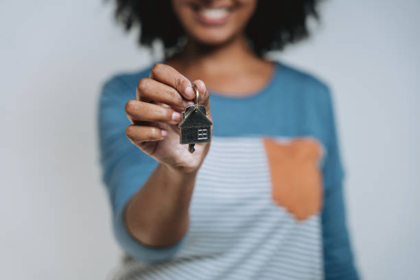 istock Woman holding house key 2169905475