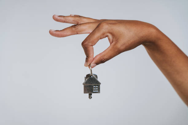 istock Hand holding house key 2169905484