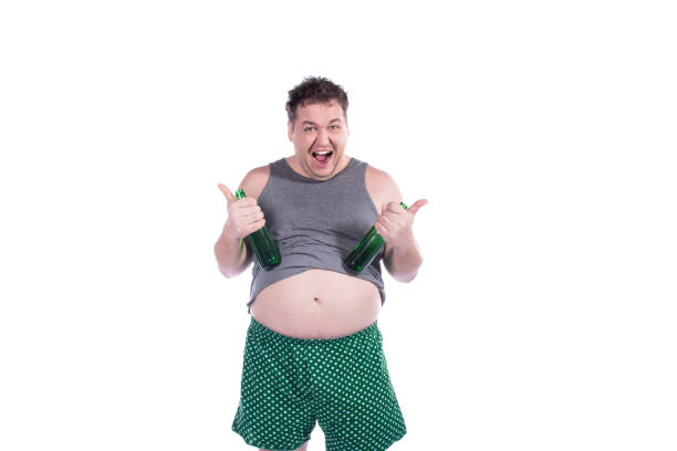 istock Funny fat man drinks green beer. White background. 2169906248