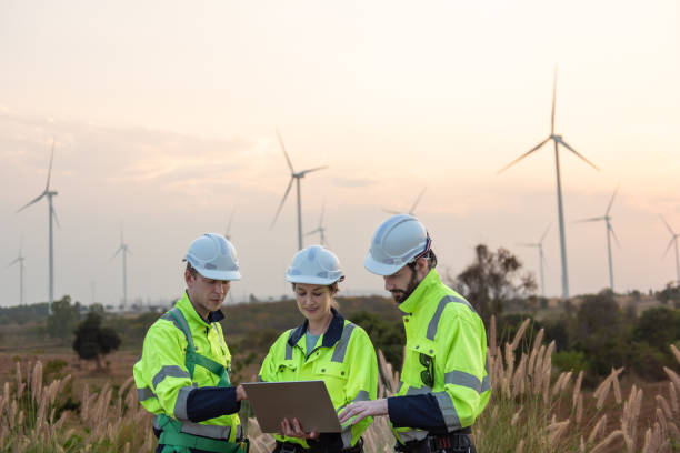 istock Engineers working on site in wind turbine farm, Wind turbines generate clean energy source, Eco technology for electric 2169908934