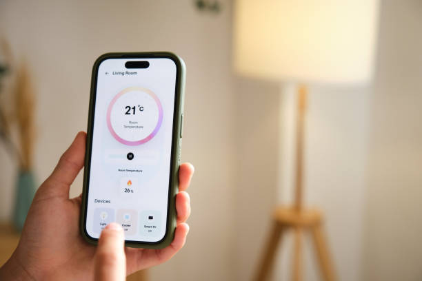 istock Person controlling home lights using smart home application on smartphone 2169909437