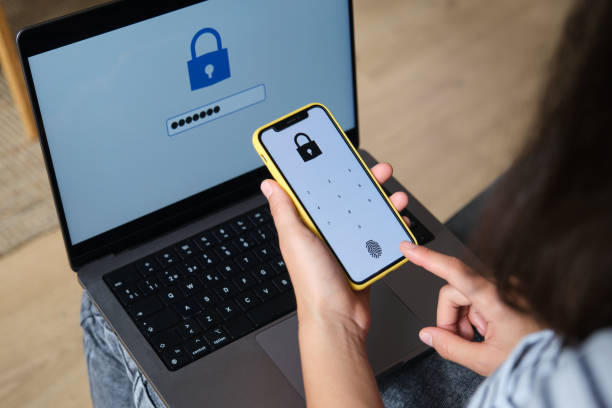 istock Woman using biometric fingerprint scanner on smartphone for mobile payment security 2169909810