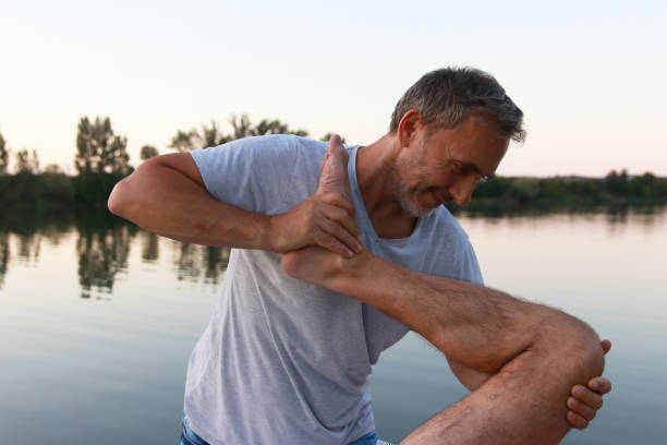 istock A man enjoys a massage by the lake 2169912559