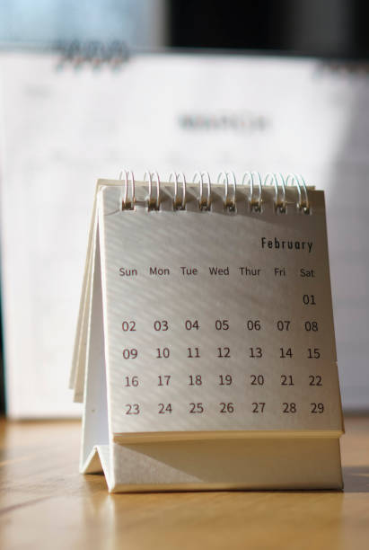 istock 2024 Calendar desk place on the table. Desktop Calender for Planner to plan agenda, timetable, appointment, organization, management each date, month, and year on wooden office table. Calendar Concept 2169914143