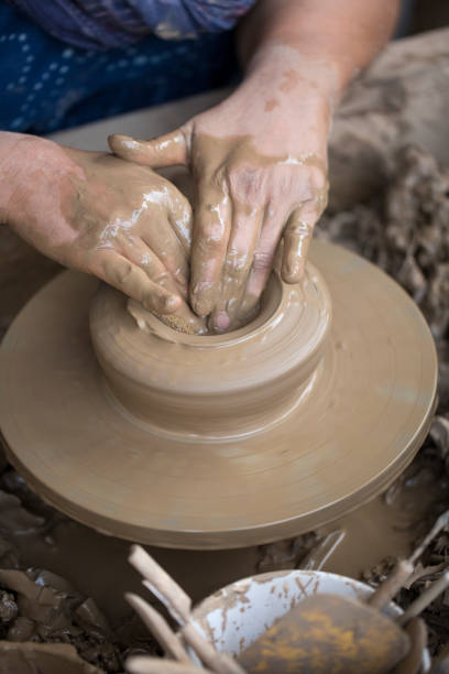 Pottery art in process on a potters wheel
