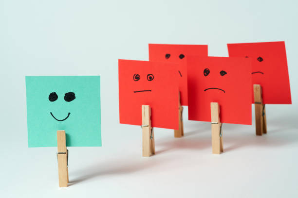 Colorful paper signs expressing emotions arranged creatively on a white background