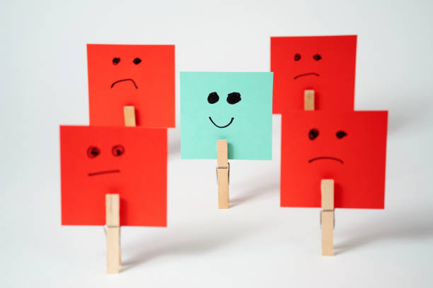 istock Colorful paper signs expressing emotions arranged creatively on a white background 2169914510