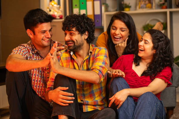 istock Happy friends talking and spending leisure time at home 2169917770