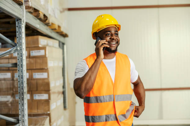 istock Smiling diverse storage worker having phone call in facility. 2169921274