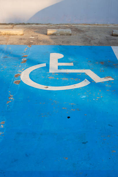 istock Disabled parking place. Disabled parking sign on the asphalt 2169934066